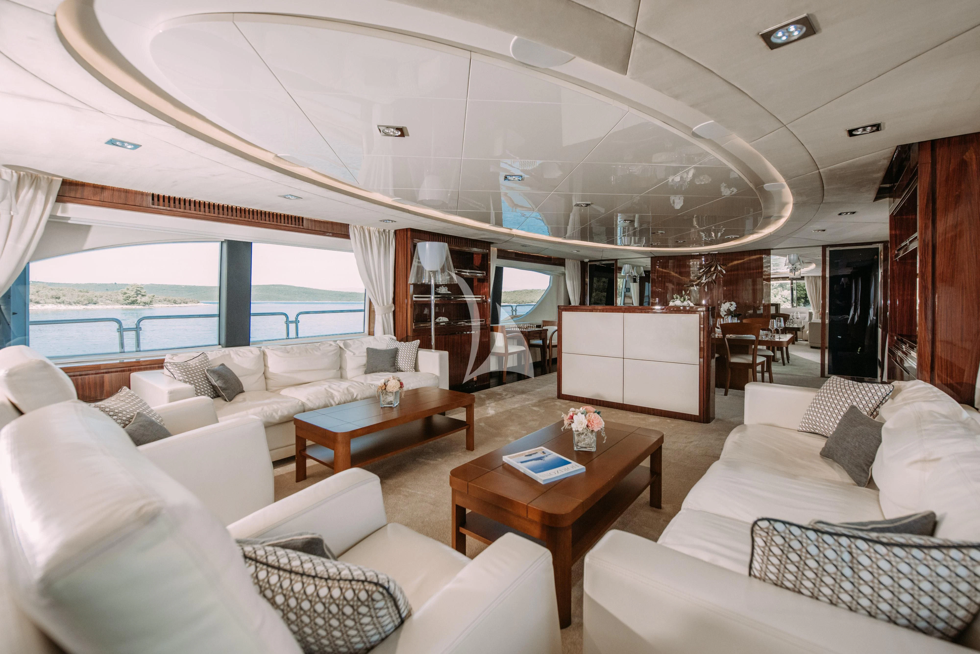 a living room with a large window aboard ARTEMY Yacht for Sale