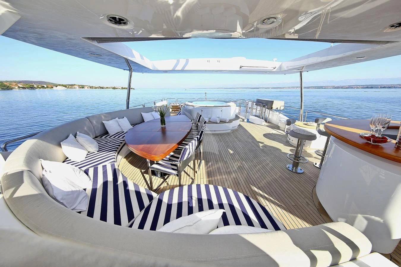 a boat with a table and chairs on the deck aboard ARTEMY Yacht for Sale