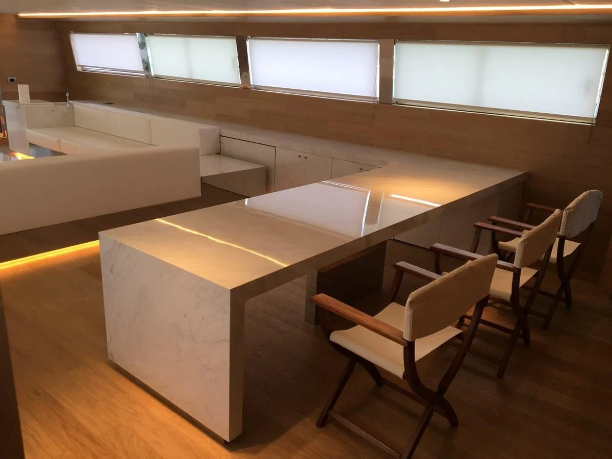 a room with chairs and a table aboard SHAMEKH Yacht for Sale