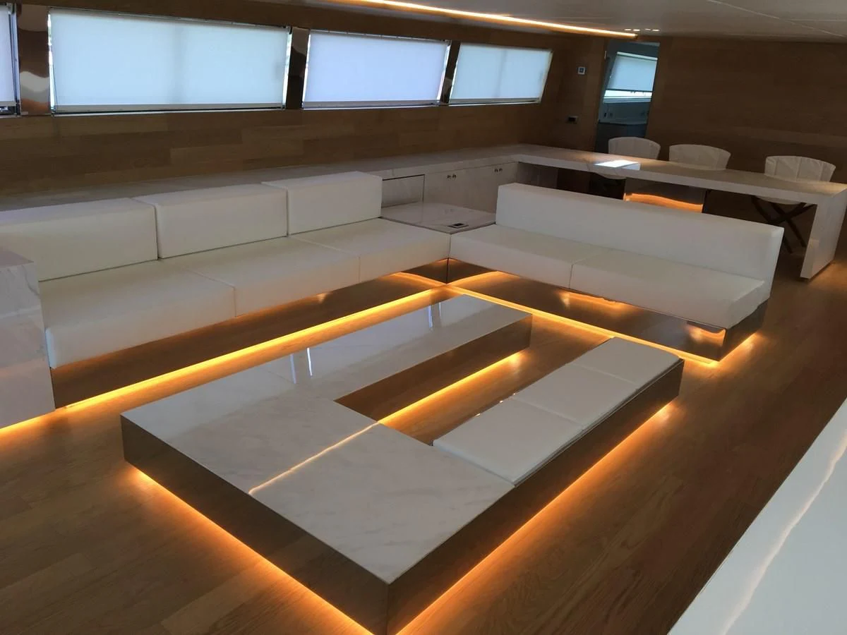 a room with a row of seats aboard SHAMEKH Yacht for Sale