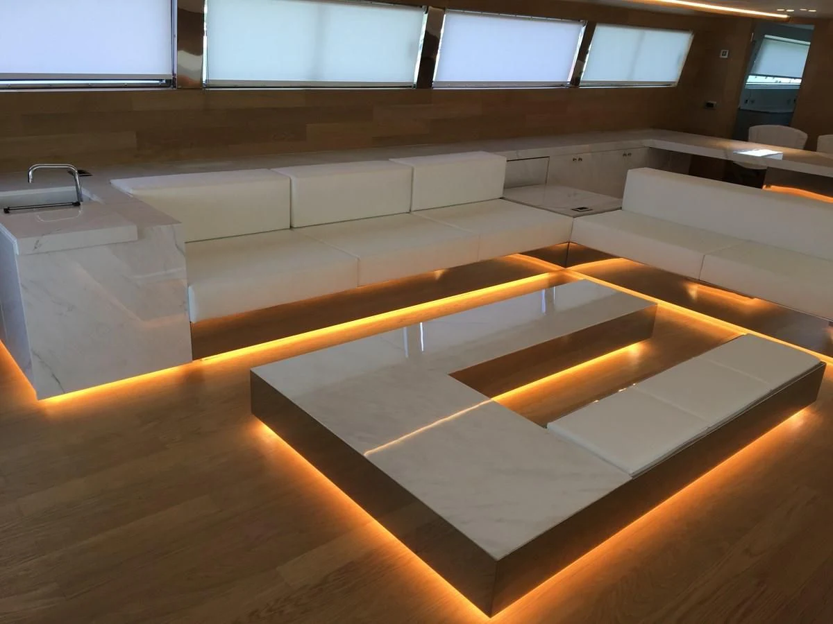 a room with a row of seats aboard SHAMEKH Yacht for Sale