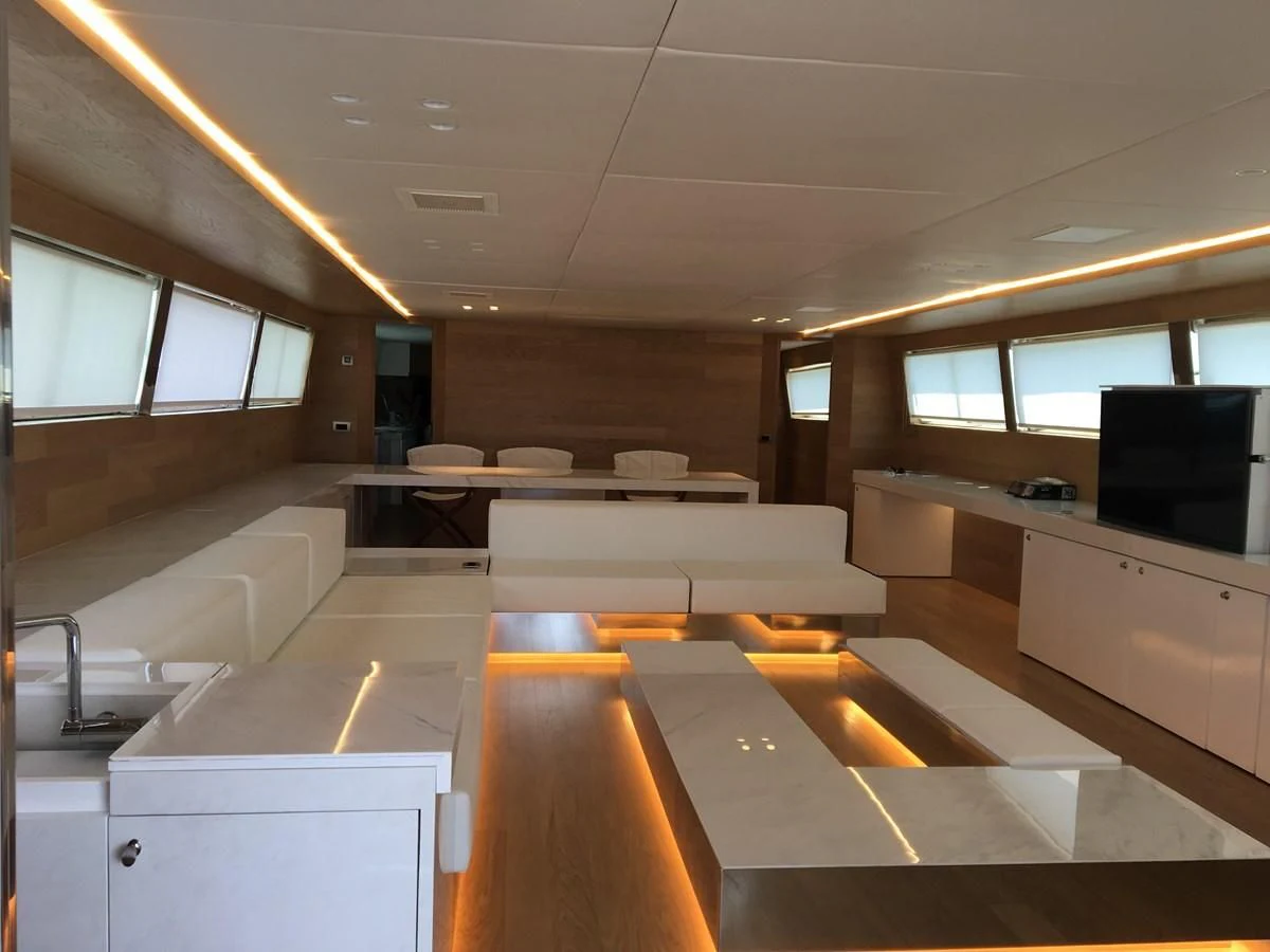 a room with a large window and a desk with a computer on it aboard SHAMEKH Yacht for Sale