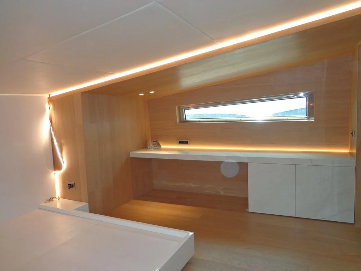 a room with a tv and a shelf aboard SHAMEKH Yacht for Sale