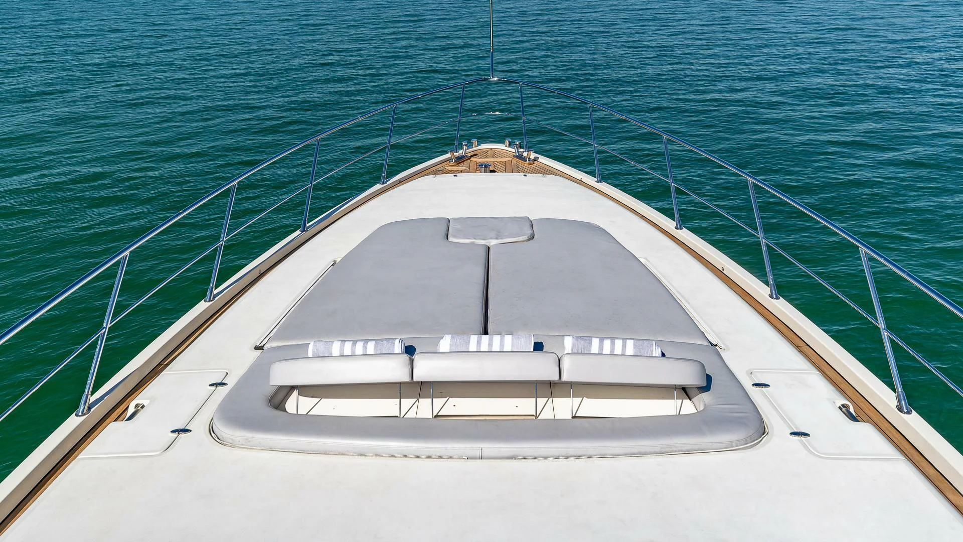 a white boat on the water aboard M Yacht for Charter