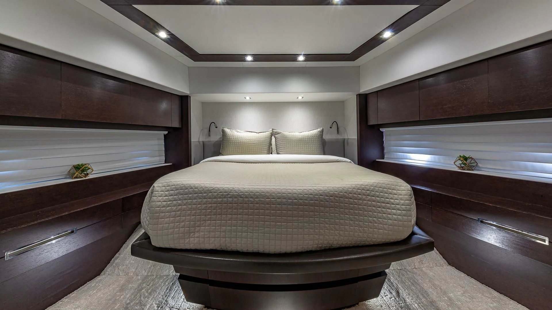 a room with a bed and a desk aboard M Yacht for Charter
