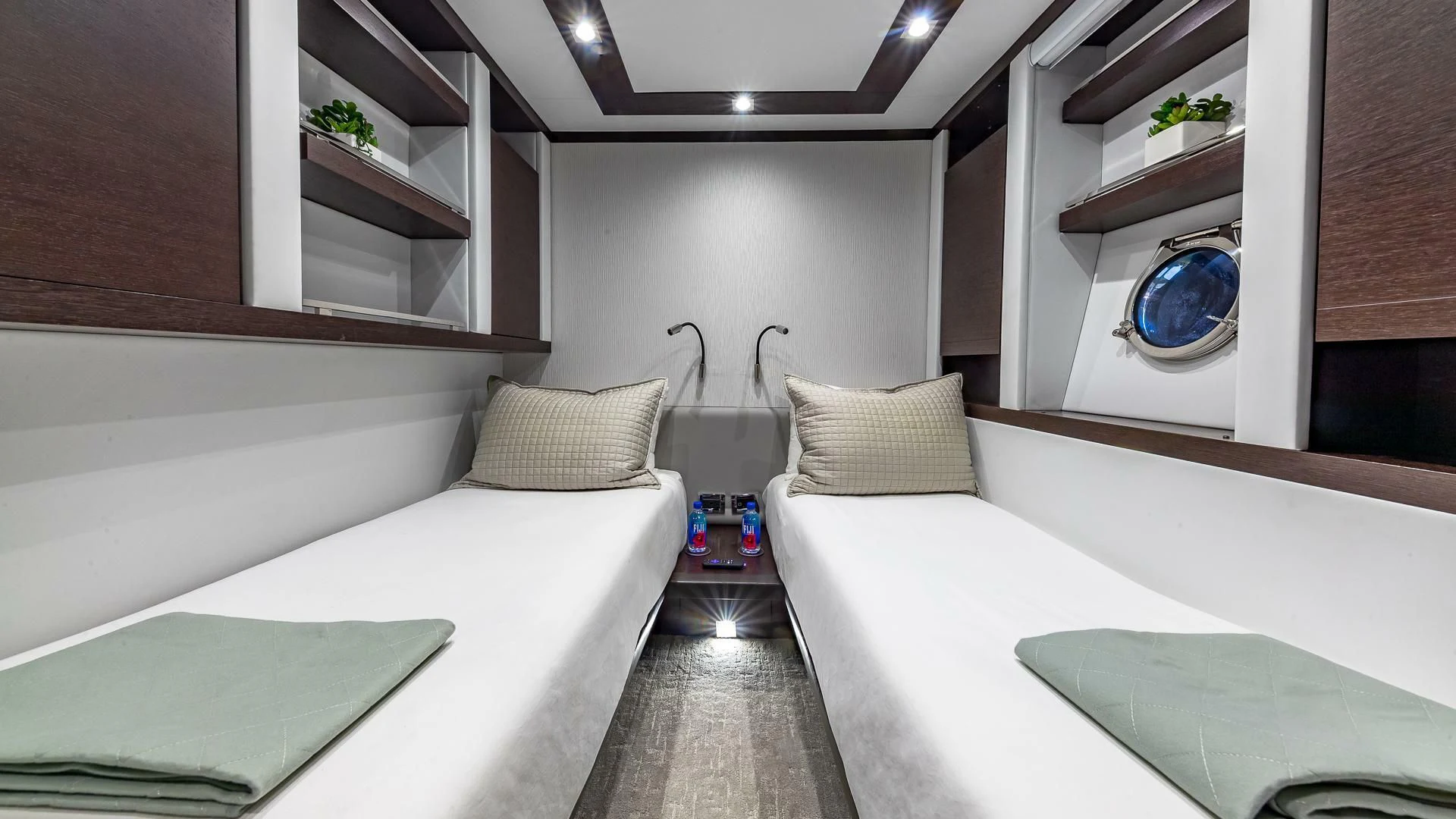a room with a bed and a table aboard M Yacht for Charter