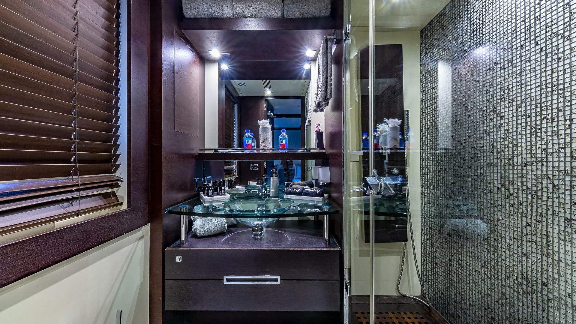 a kitchen with a sink and cabinets aboard M Yacht for Charter
