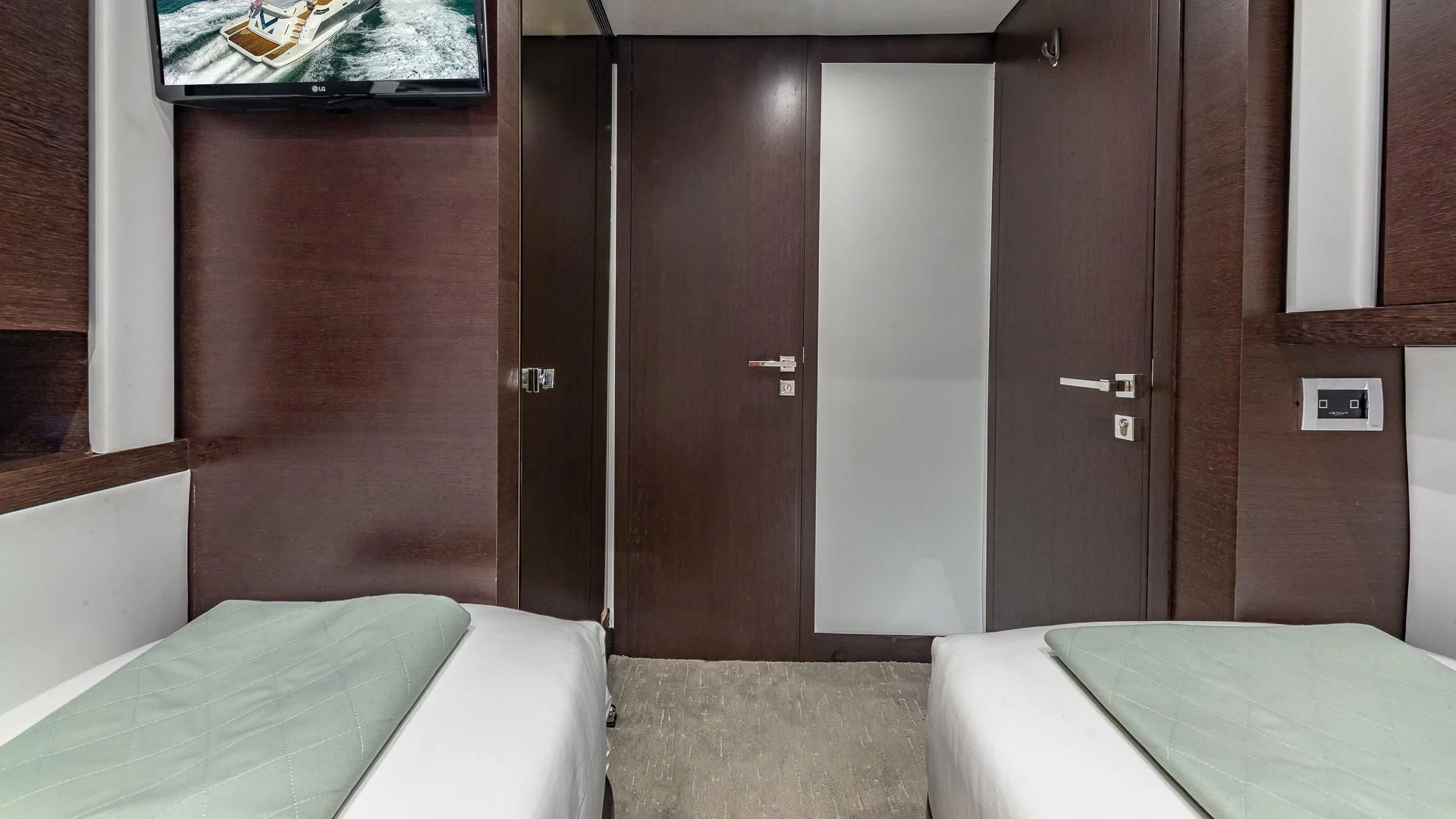 a room with a bed and a door aboard M Yacht for Charter