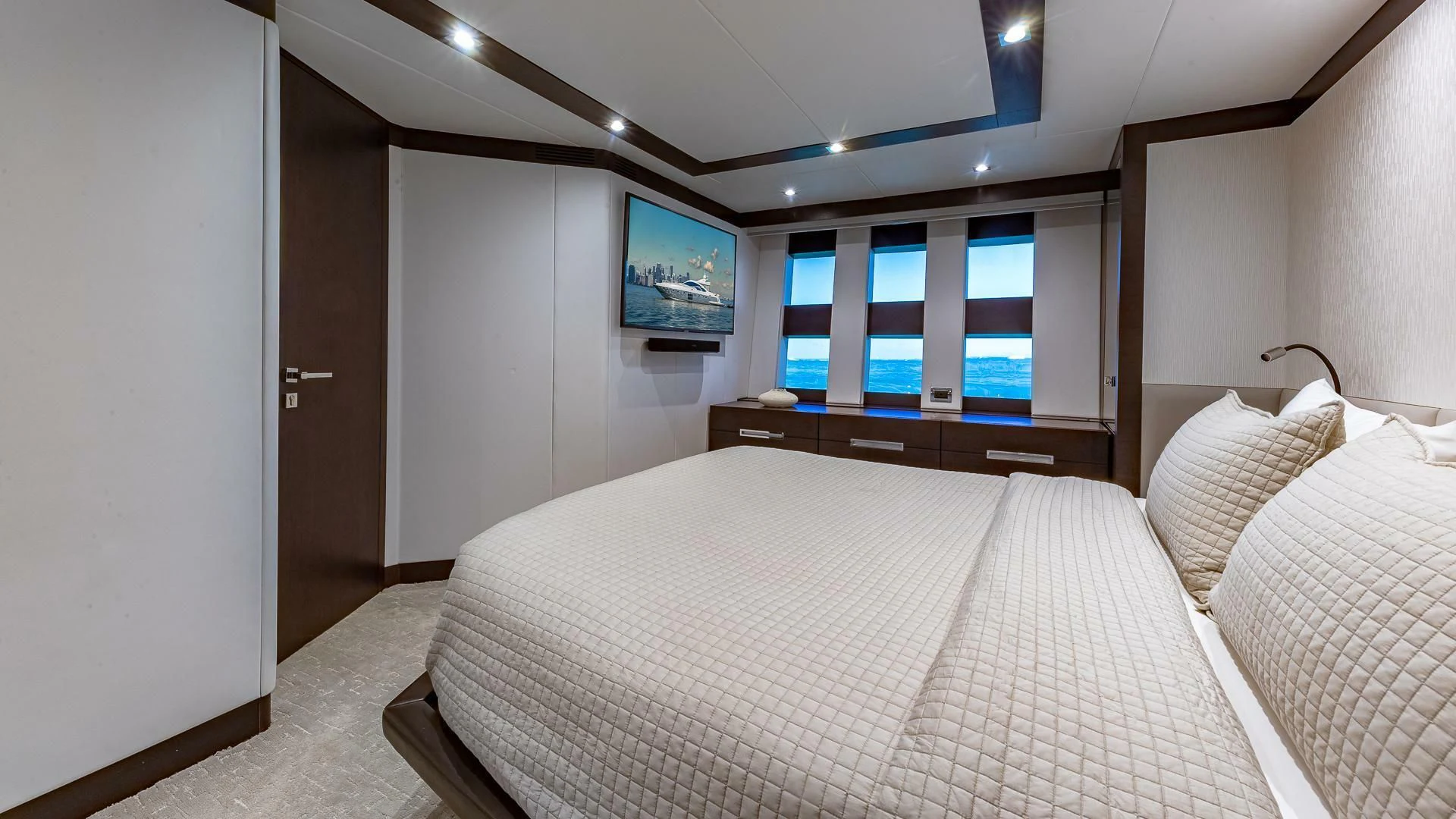 a bed with a white sheet aboard M Yacht for Charter