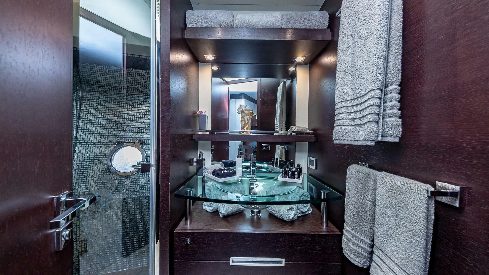 a bathroom with a sink and a mirror aboard M Yacht for Charter