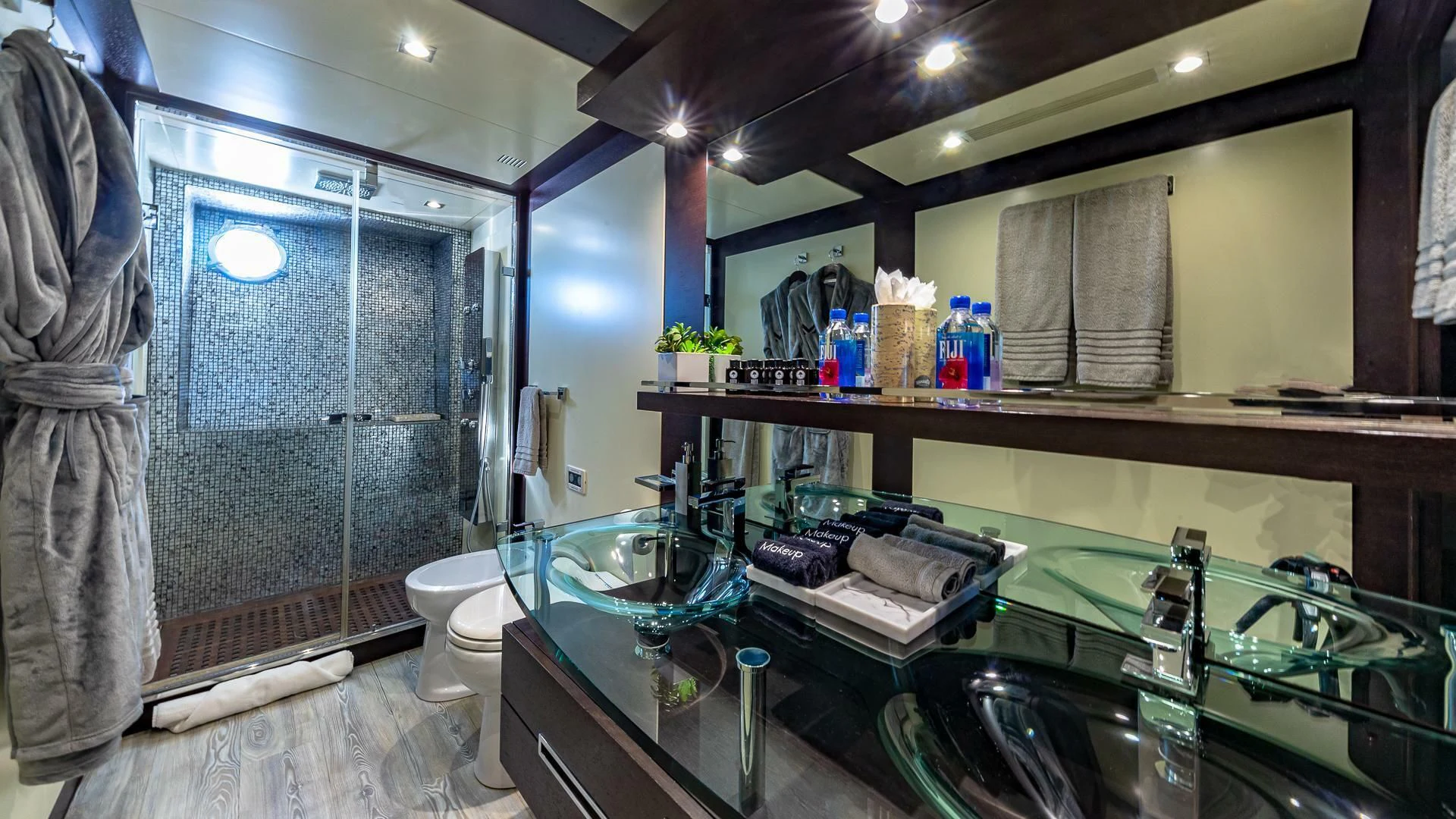 a bathroom with a sink and a shower aboard M Yacht for Charter