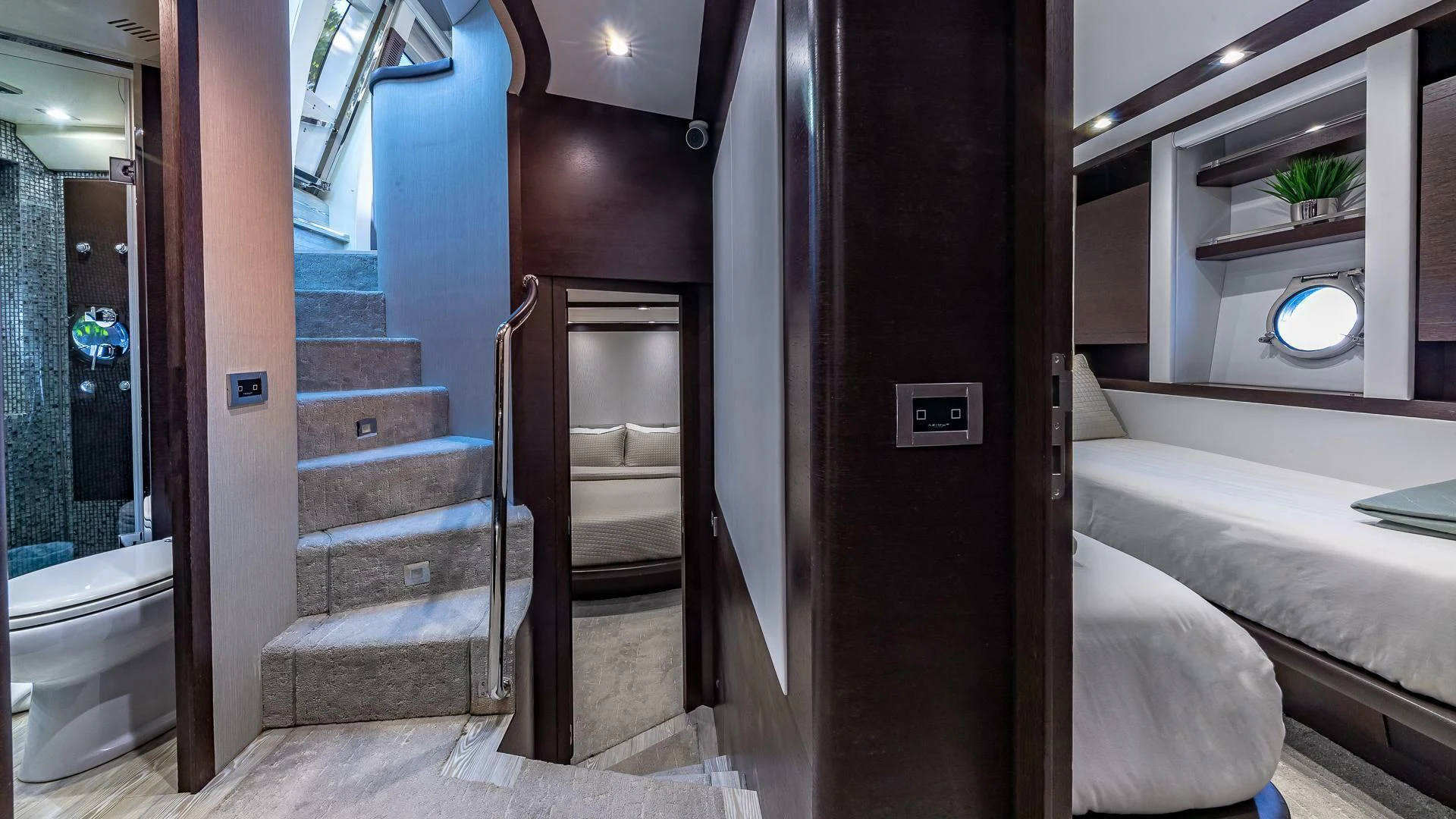 a room with a bed and a mirror aboard M Yacht for Charter