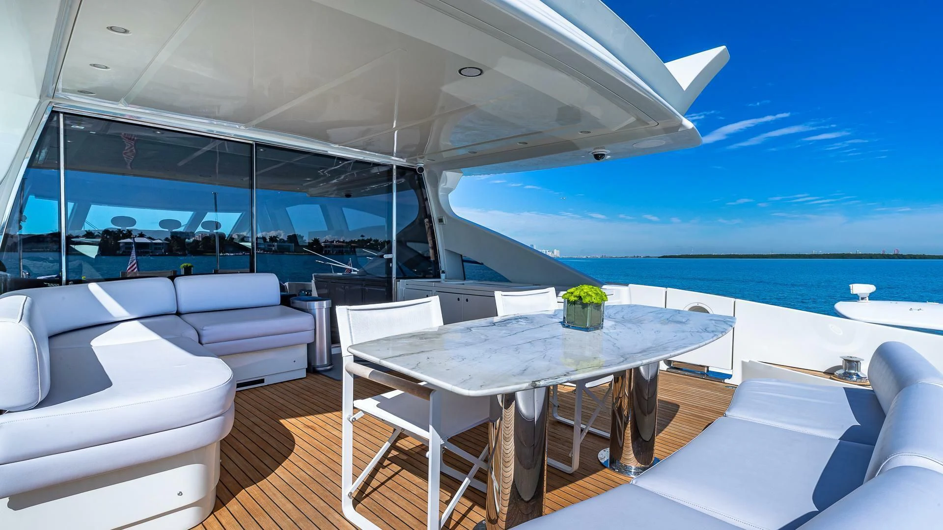 a large white table on a boat aboard M Yacht for Charter