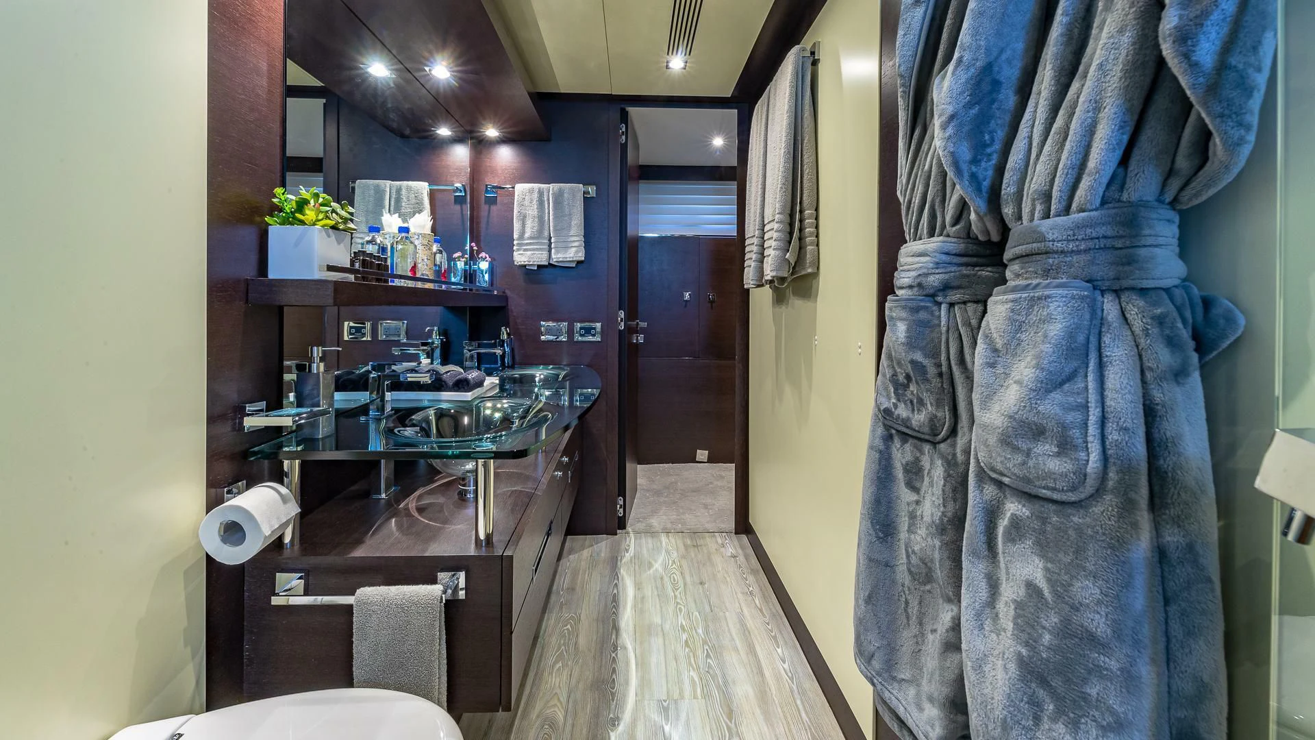 a room with a table and a sink aboard M Yacht for Charter