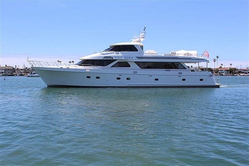 a white yacht in the water aboard ANACAPA Yacht for Sale