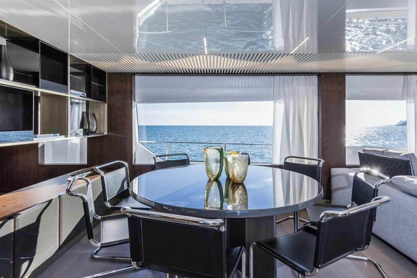 a table with glasses on it aboard FERRETTI YACHTS 850 Yacht for Sale