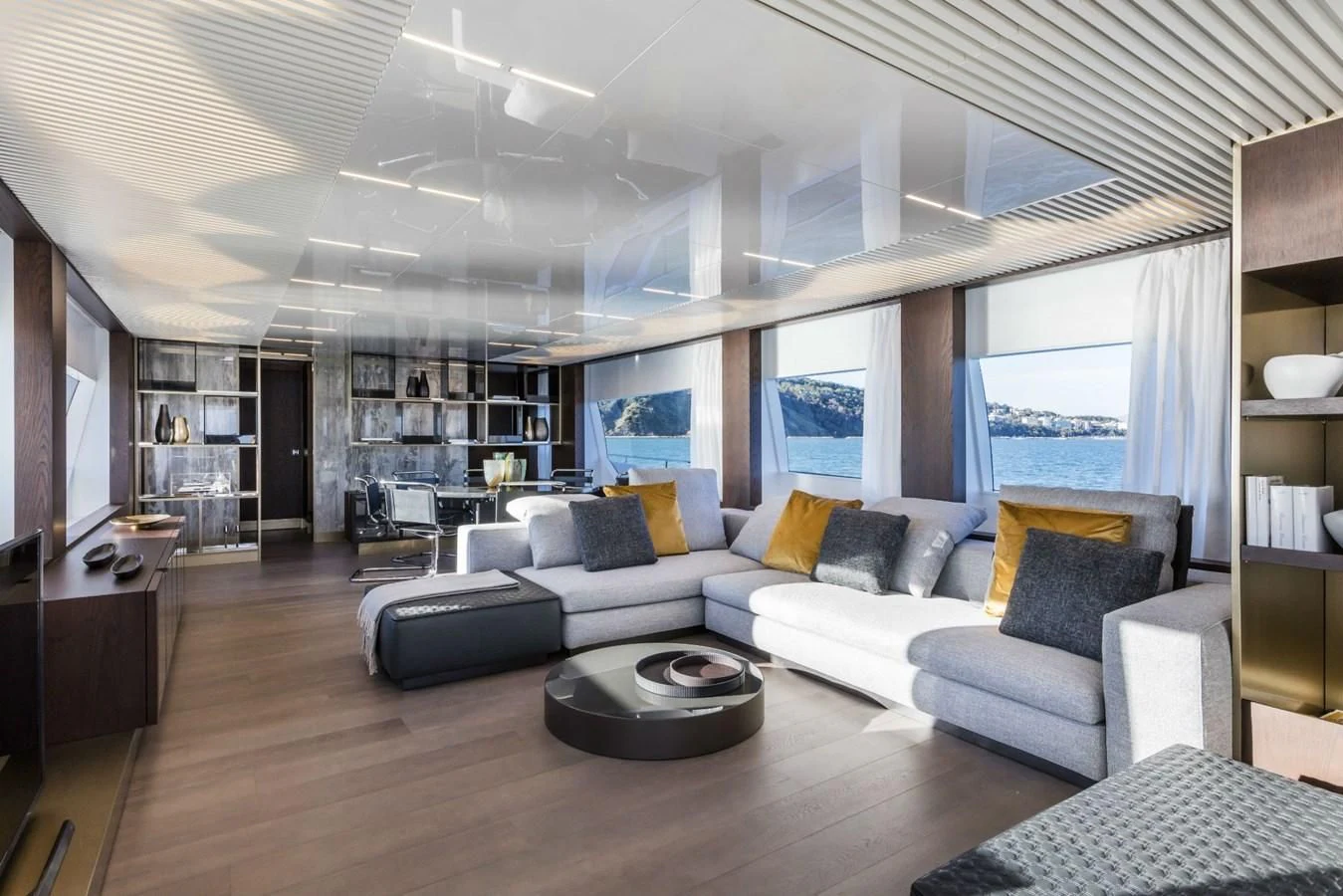 a living room with a large window aboard FERRETTI YACHTS 850 Yacht for Sale