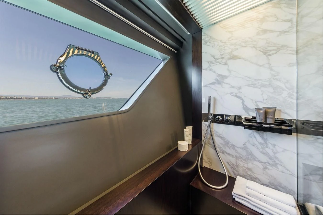 a room with a mirror and a guitar from the ceiling aboard FERRETTI YACHTS 850 Yacht for Sale