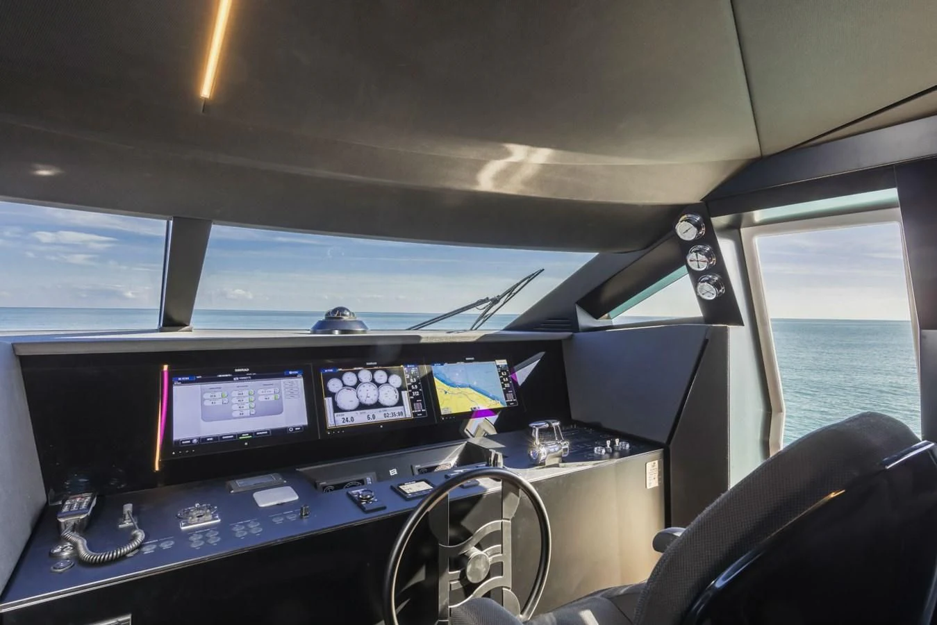 a cockpit with a desk and monitors aboard FERRETTI YACHTS 850 Yacht for Sale