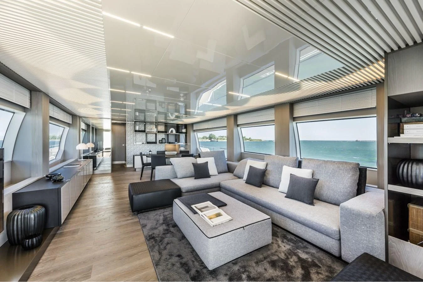 a living room with a large window aboard FERRETTI YACHTS 850 Yacht for Sale