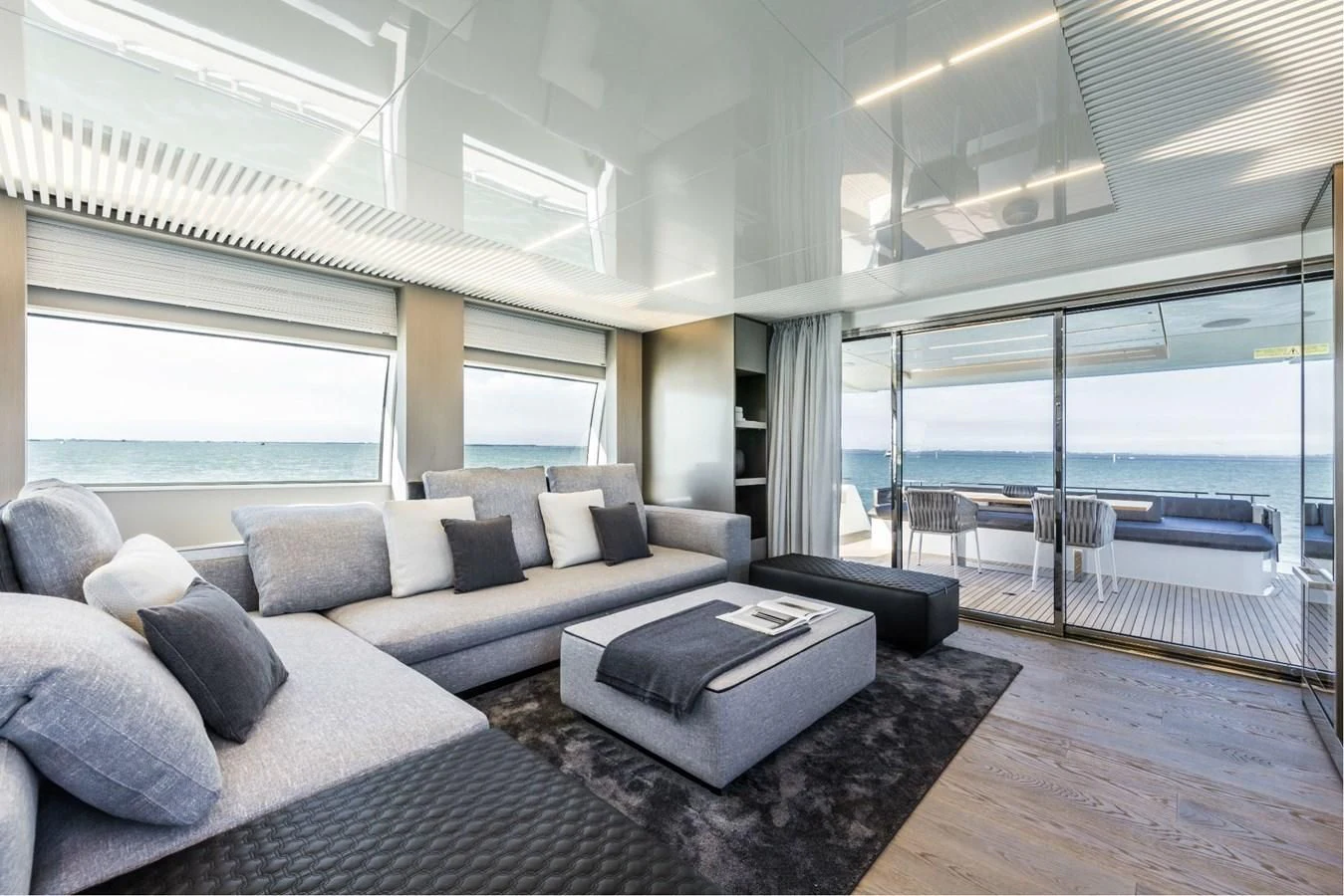 a living room with a large window aboard FERRETTI YACHTS 850 Yacht for Sale