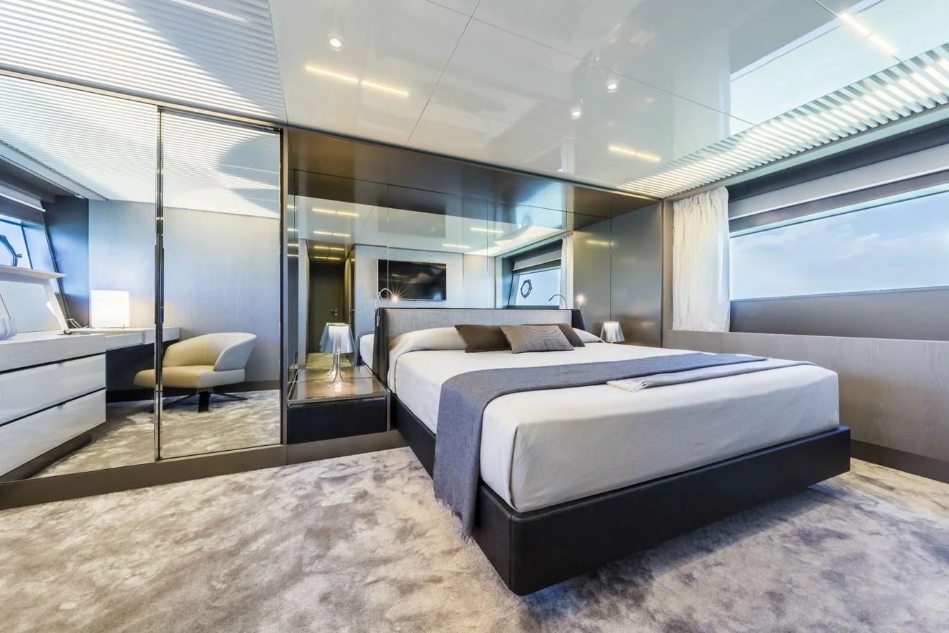 a bedroom with a large bed aboard FERRETTI YACHTS 850 Yacht for Sale