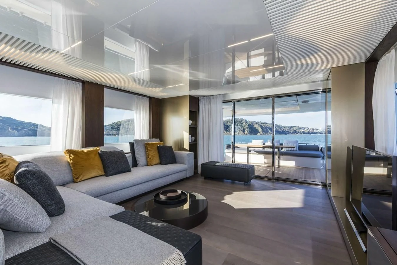 a large living room with a large window aboard FERRETTI YACHTS 850 Yacht for Sale