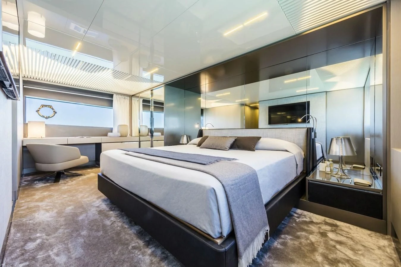 a room with a bed and a large mirror aboard FERRETTI YACHTS 850 Yacht for Sale