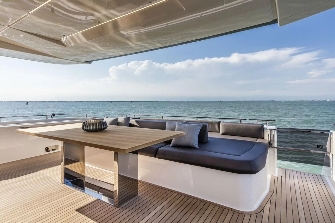 a lounge chair on a deck overlooking the ocean aboard FERRETTI YACHTS 850 Yacht for Sale