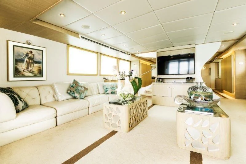 a living room with a white couch aboard GALAPAGOS EXPLORER Yacht for Sale