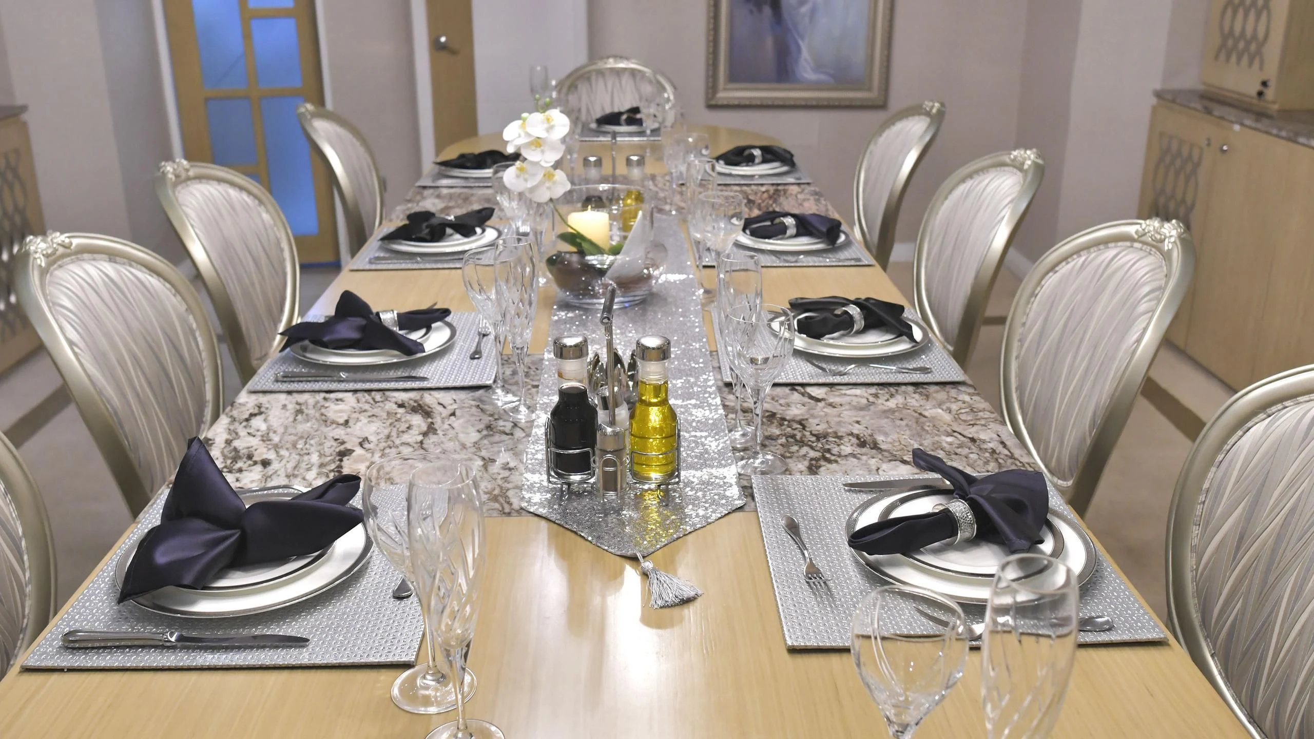 a table with plates and glasses aboard GALAPAGOS EXPLORER Yacht for Sale