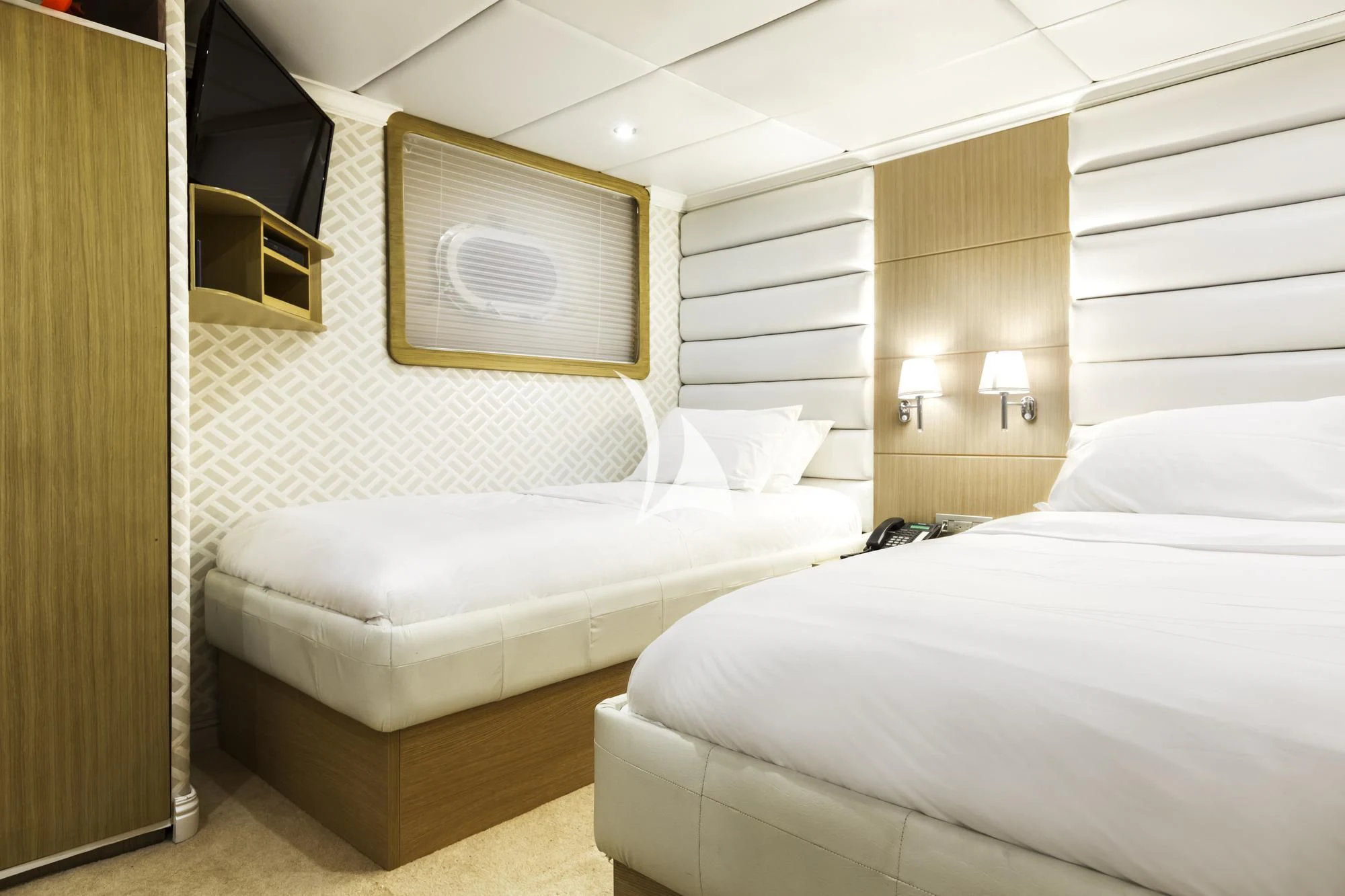 a couple of beds in a room aboard GALAPAGOS EXPLORER Yacht for Sale
