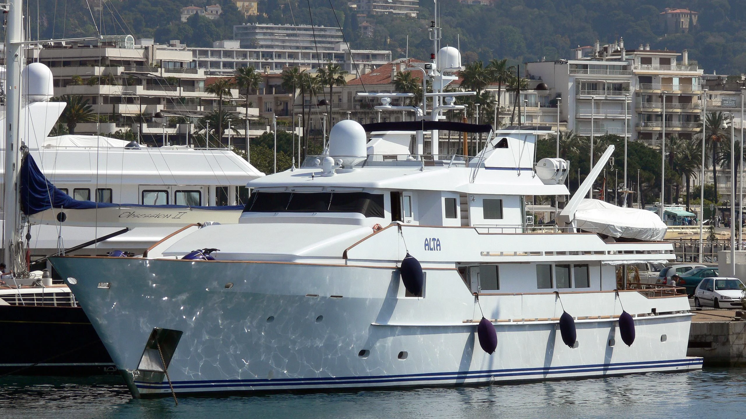 a couple of boats sit in a harbor aboard GALAPAGOS EXPLORER Yacht for Sale