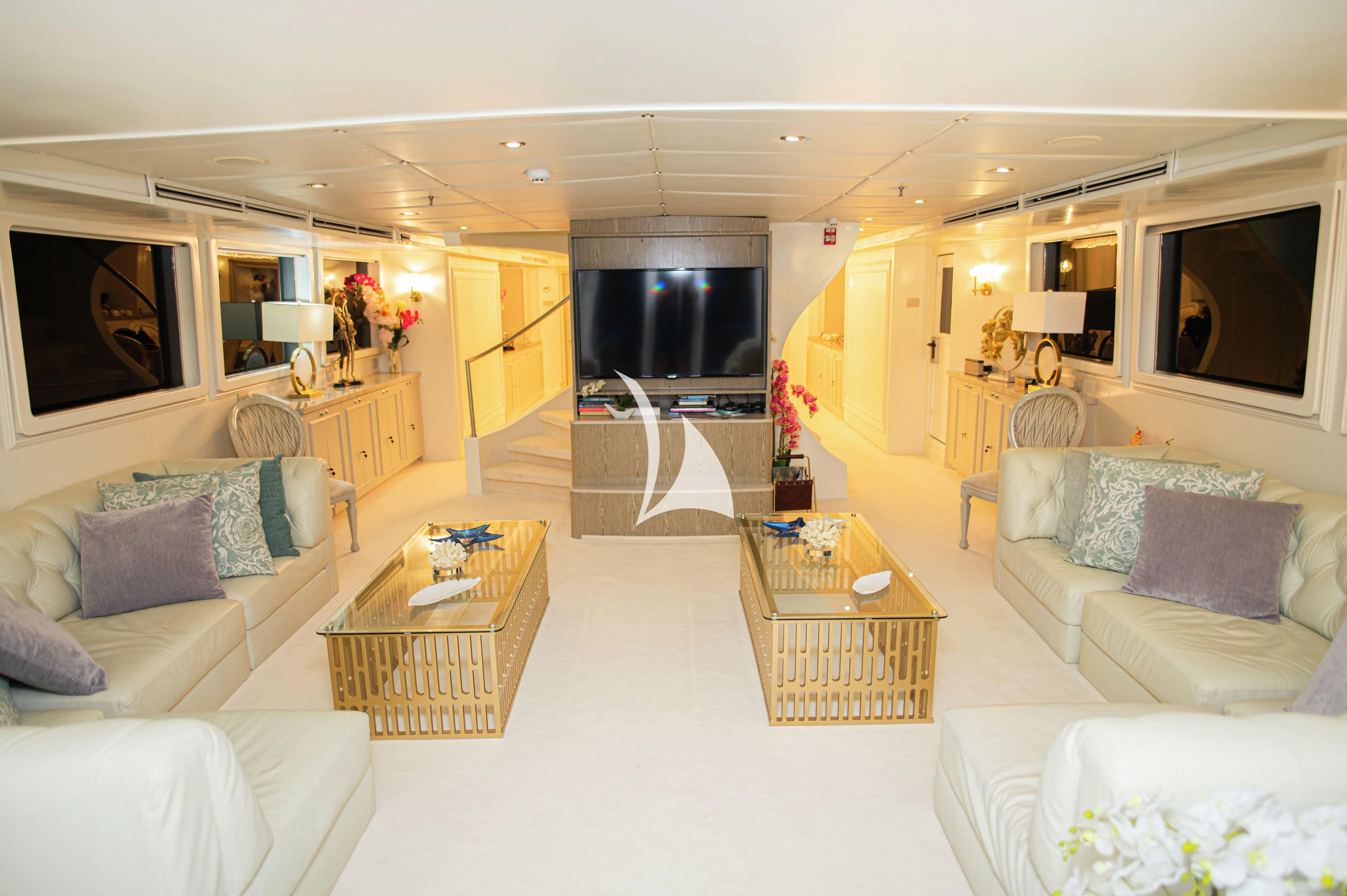 a living room with a fireplace aboard GALAPAGOS EXPLORER Yacht for Sale