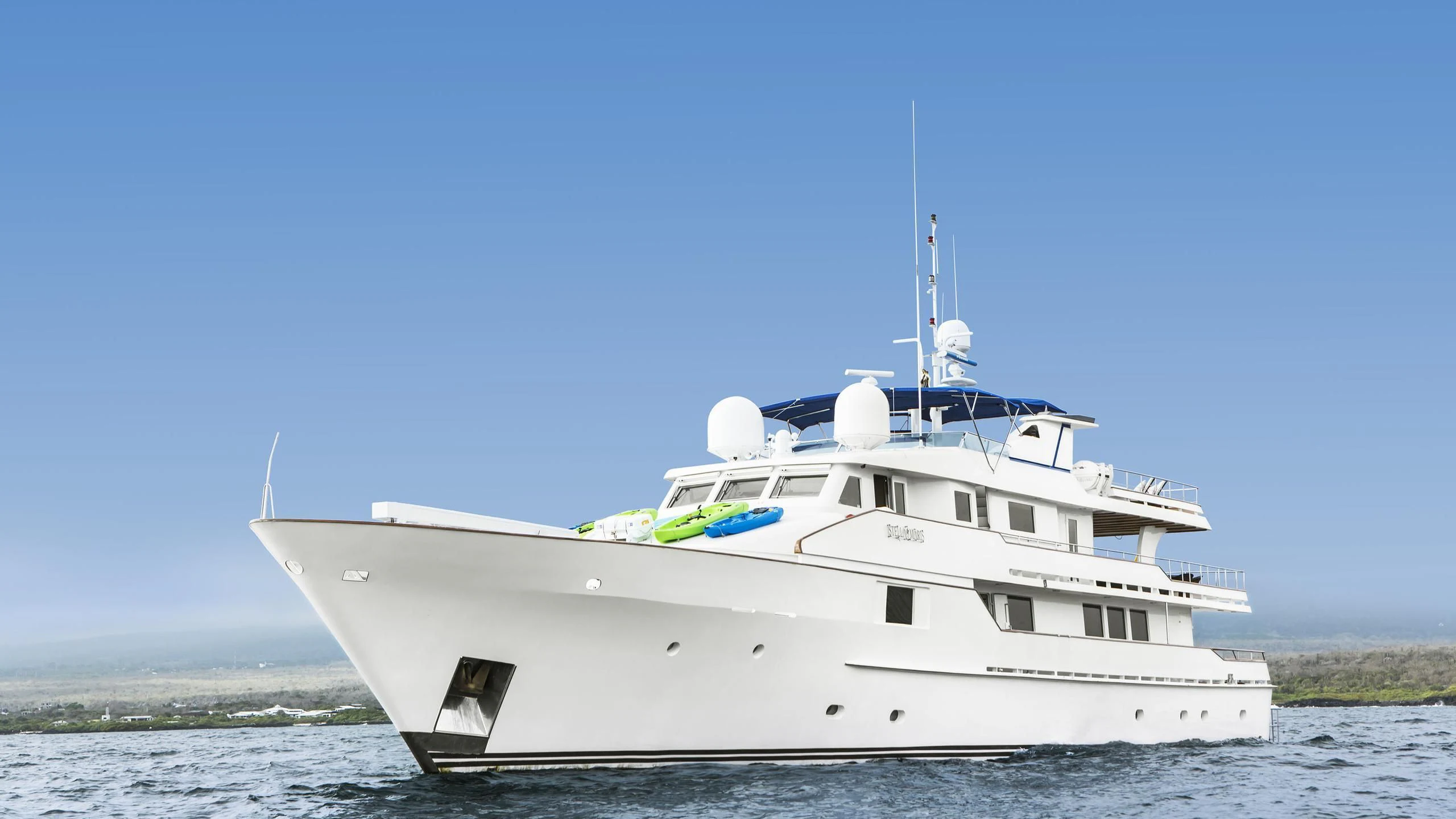 a white boat in the water aboard GALAPAGOS EXPLORER Yacht for Sale