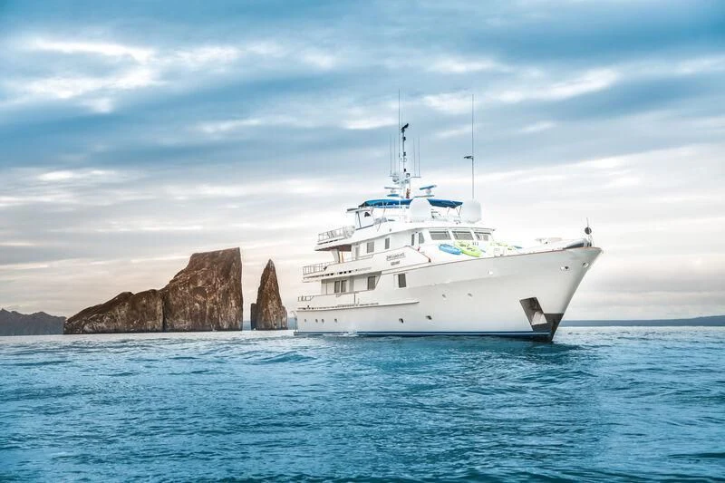 a white boat in the water aboard GALAPAGOS EXPLORER Yacht for Sale