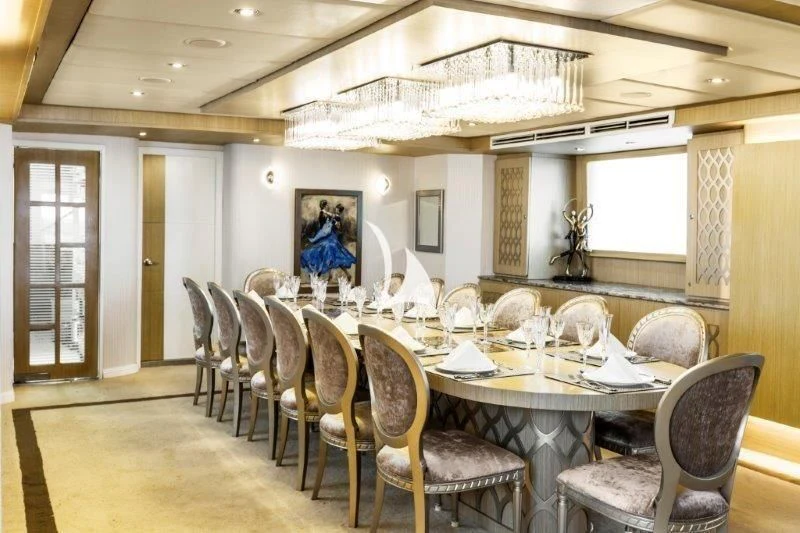 a dining room with chairs and a table aboard GALAPAGOS EXPLORER Yacht for Sale