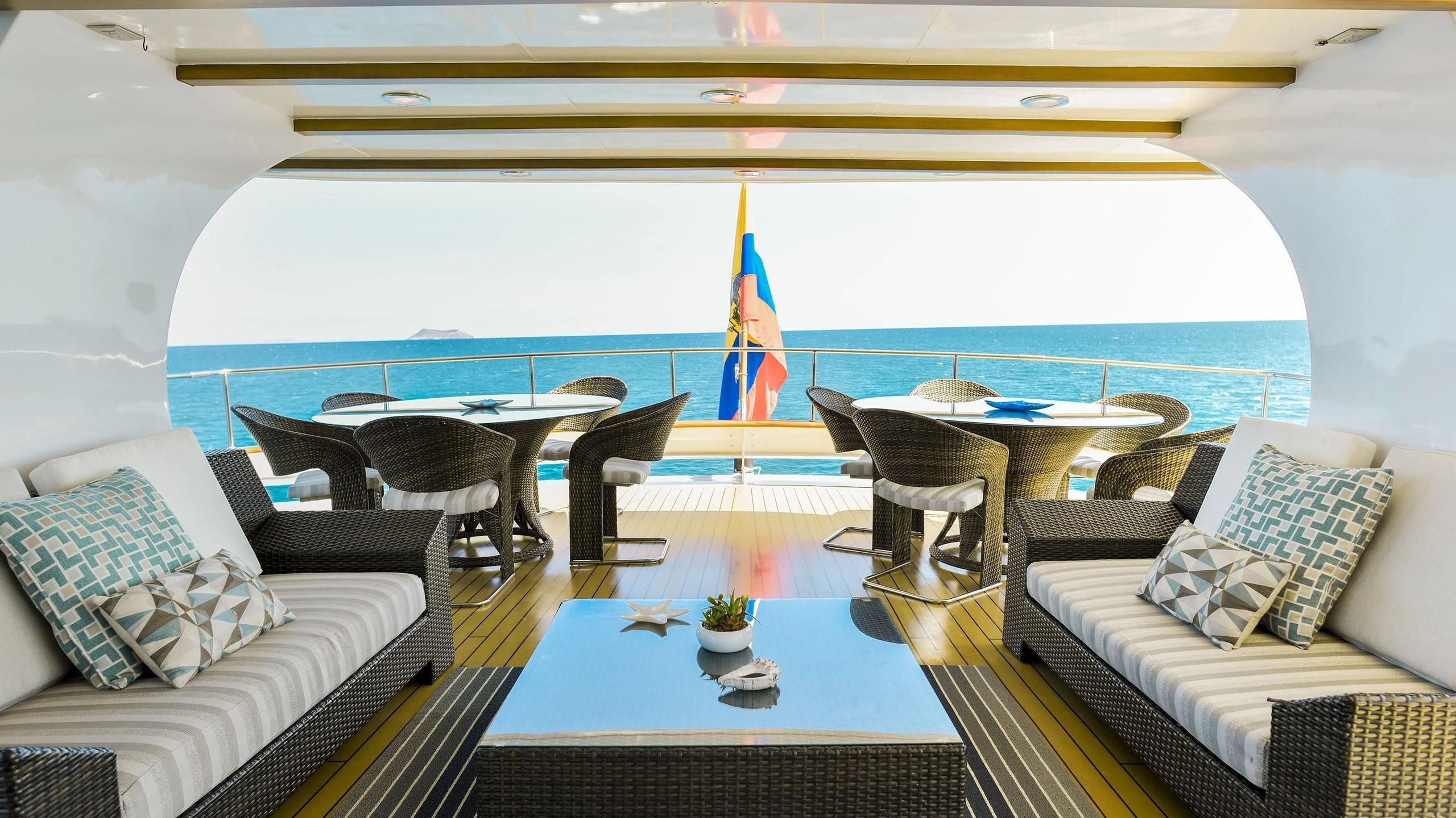 a room with a table chairs and a large window aboard GALAPAGOS EXPLORER Yacht for Sale