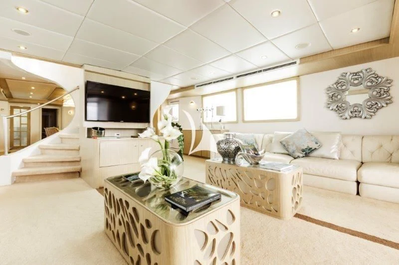 a living room with a couch and a tv aboard GALAPAGOS EXPLORER Yacht for Sale