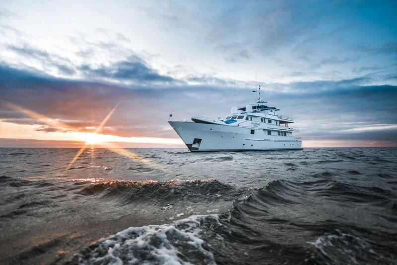 a boat on the water aboard GALAPAGOS EXPLORER Yacht for Sale