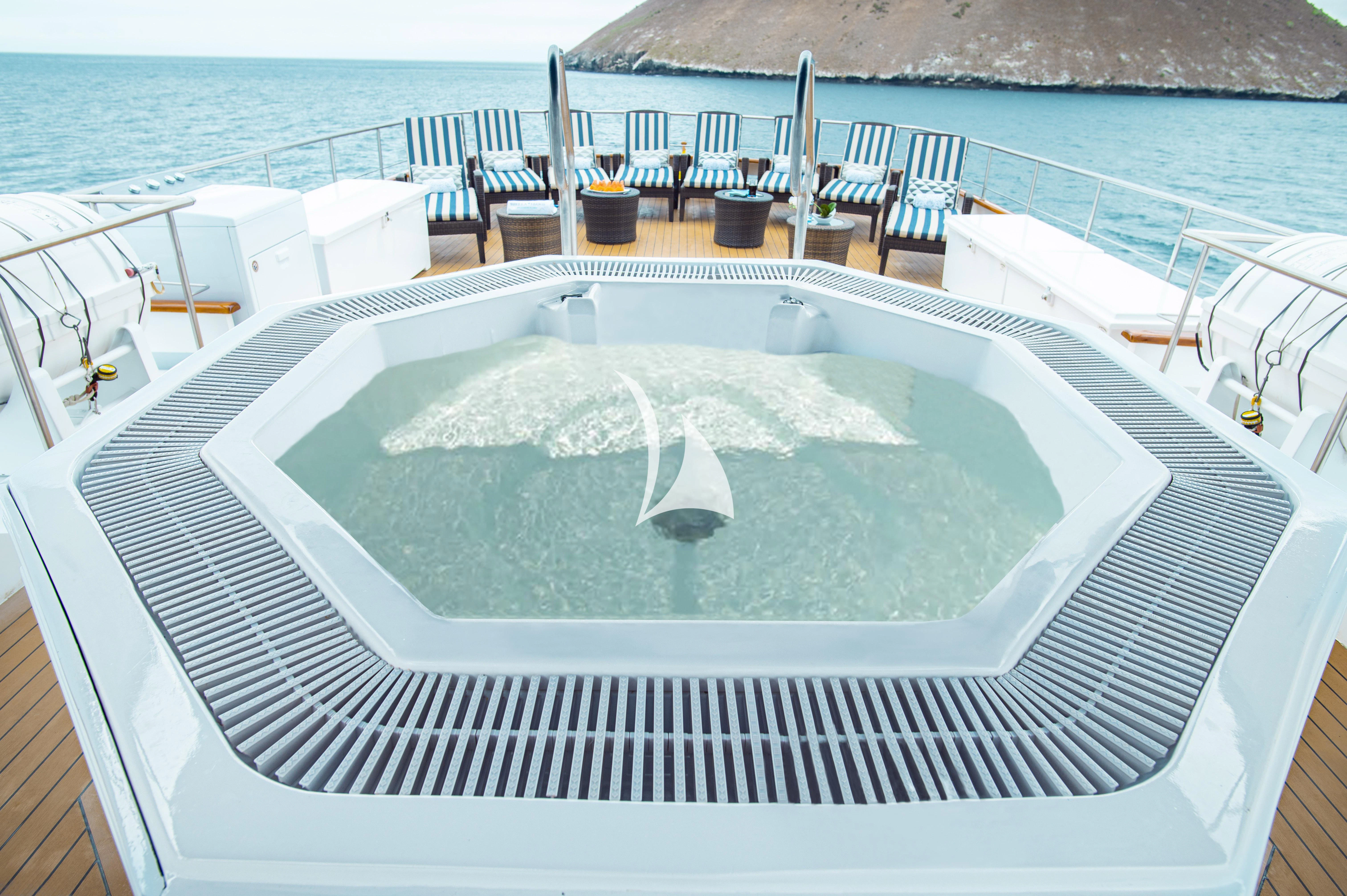 a swimming pool on a deck aboard GALAPAGOS EXPLORER Yacht for Sale
