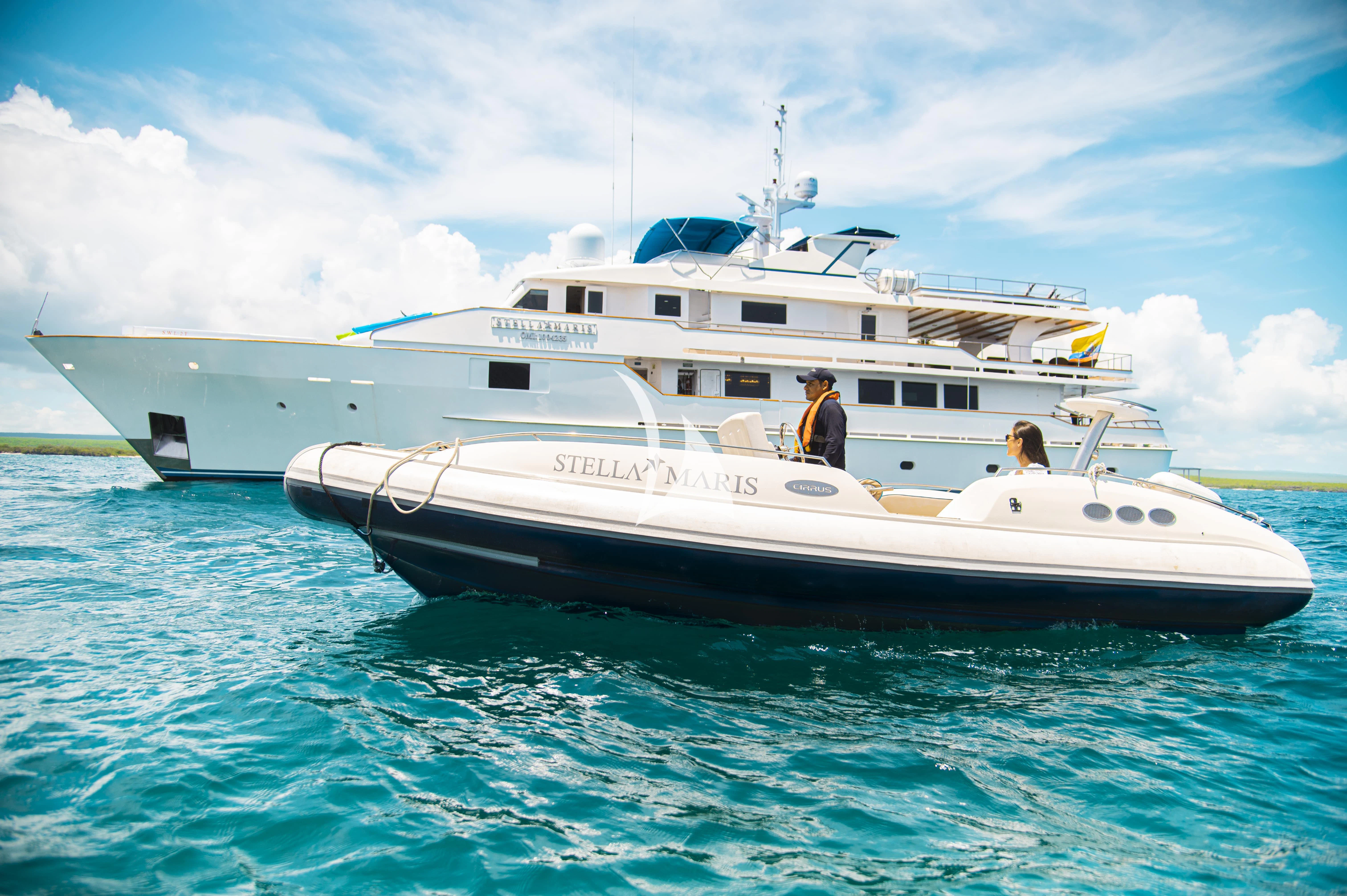 a white boat in the water aboard GALAPAGOS EXPLORER Yacht for Sale