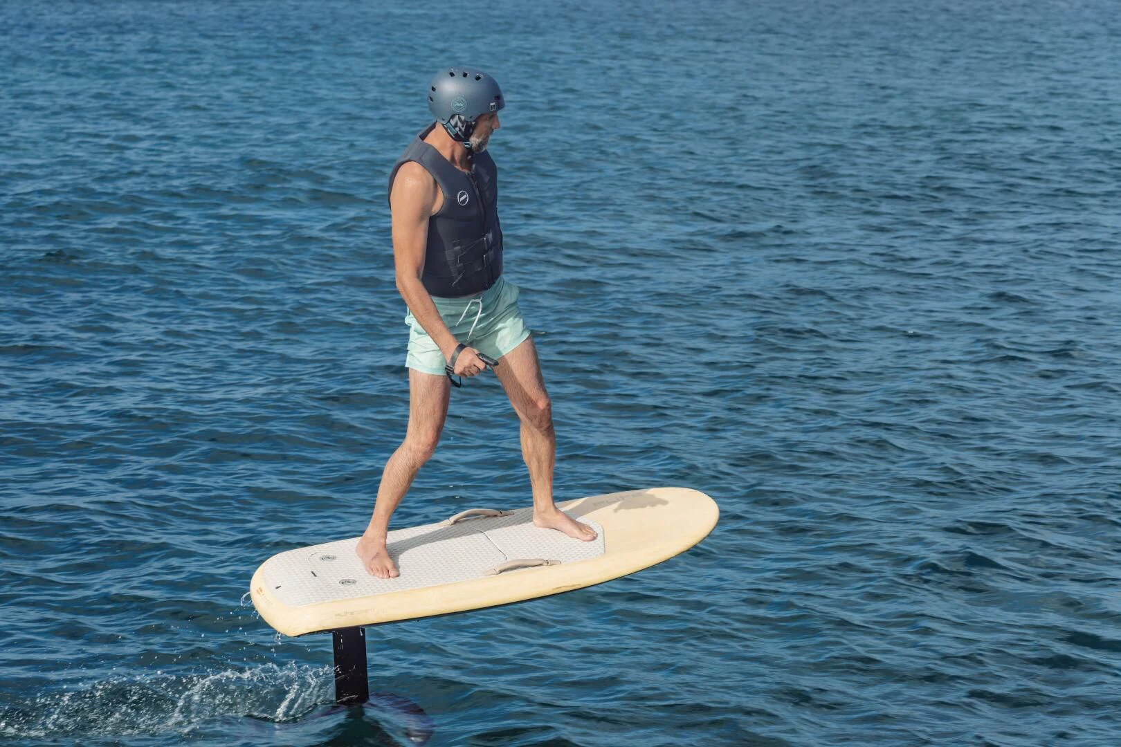 a person on a surfboard aboard OCEANUS Yacht for Sale