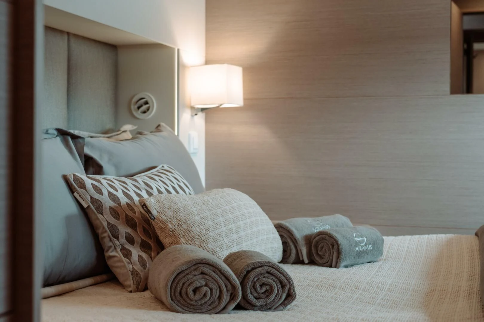 a bed with pillows aboard OCEANUS Yacht for Sale