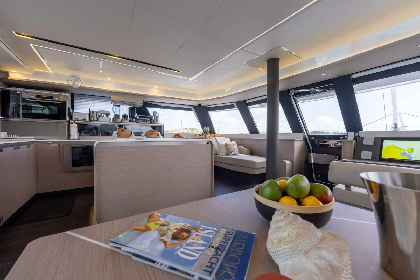 a kitchen with a bowl of fruit aboard OCEANUS Yacht for Sale