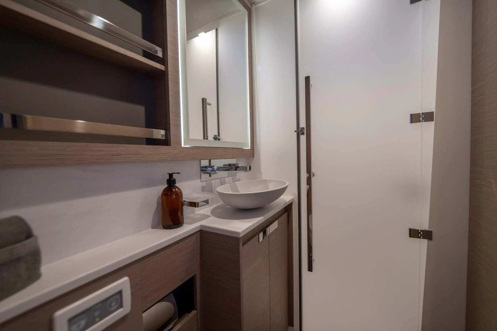 a sink and a mirror in a bathroom aboard OCEANUS Yacht for Sale
