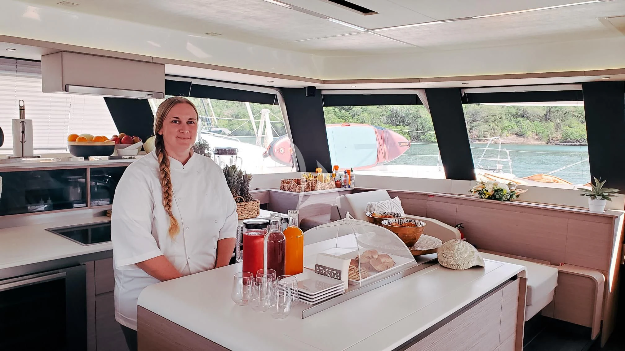 a person sitting at a table aboard OCEANUS Yacht for Sale
