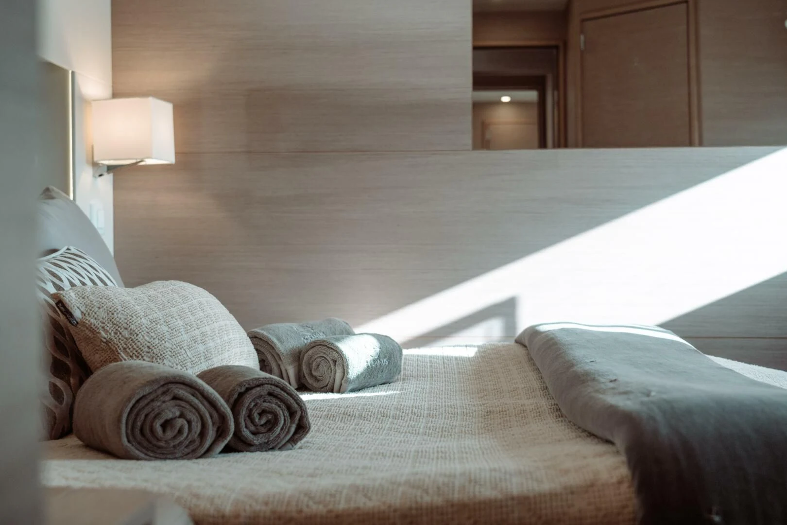 a bed with pillows aboard OCEANUS Yacht for Sale