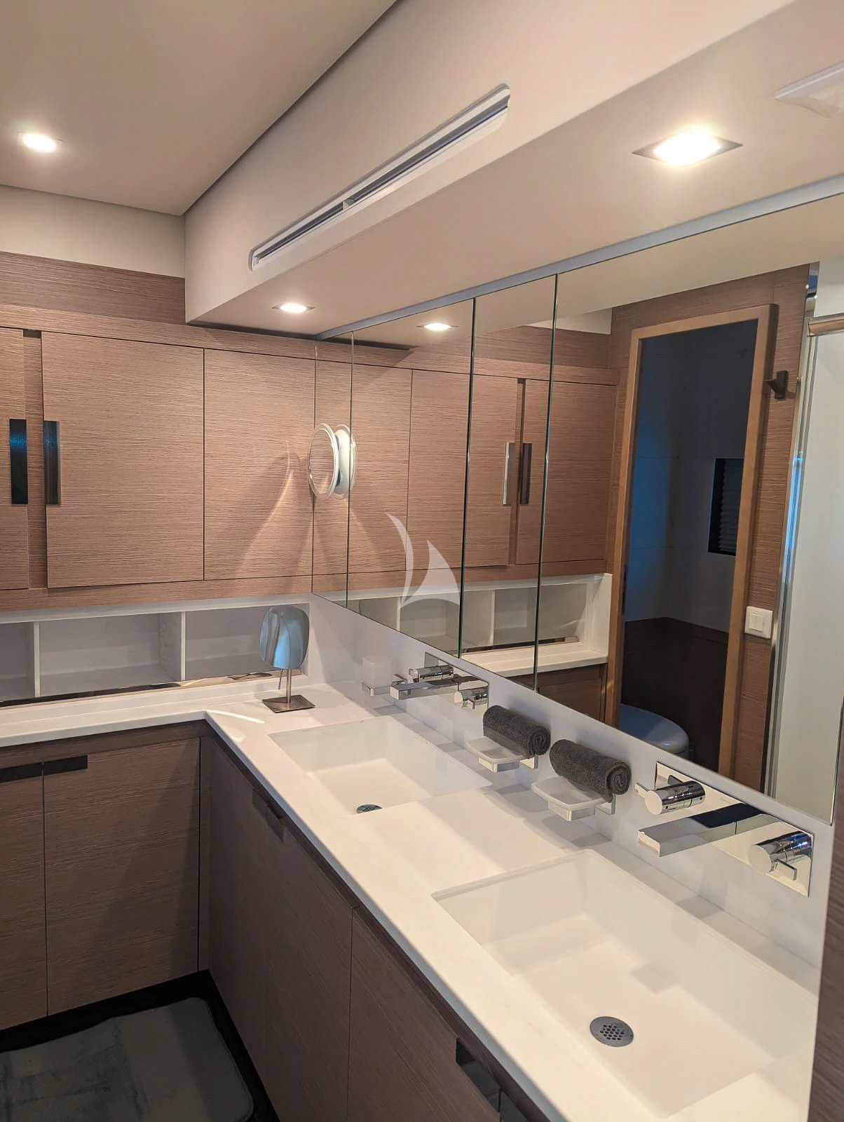 a bathroom with a large mirror aboard OCEANUS Yacht for Sale