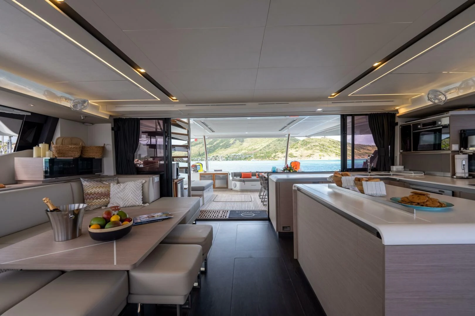 a kitchen with a large window aboard OCEANUS Yacht for Sale